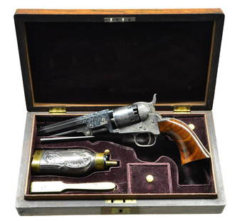 VERY FINE CASED COLT 49 POCKET MODEL ENGRAVED BY: GUSTAVE YOUNG. Cal. 31. S# 58400. The 5" blued octagon barrel is engraved "Saml Colt" on top flat and has loading lever affixed to bottom. Case hardened action is engraved "COLTS PATENT" on left