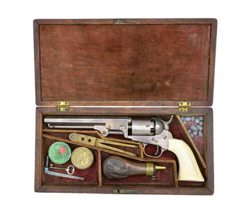 CASED COLT MODEL 1849 REVOLVER WITH IVORY GRIPS.: Cal. 36. S# 135469. Bbl. 6". Standard Model 1849 w/ desirable 6" bbl., silver plated w/ an original Colt casing & accessories. This gun presents nicely w/ their original factory elephant ivory grips.