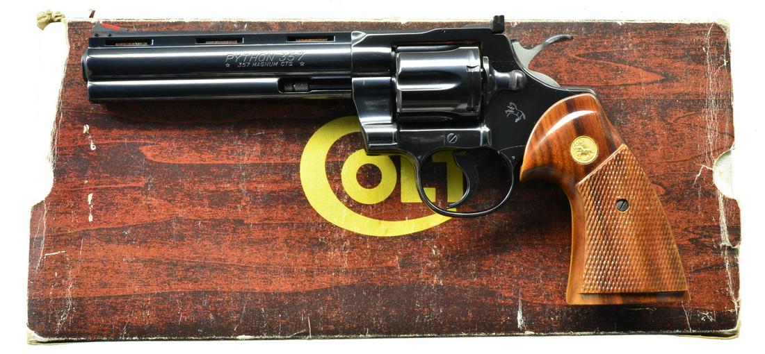 COLT PYTHON REVOLVER.: Cal. 357 Mag. S# K94064. Bbl. 6" VR w/ red insert sight blade; Accro white outline rear. Mfg. 1983 (1955-1996) w/ Royal Blue finish (1970-1996). Walnut target grips w/ raised checkered panels & gold C