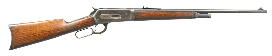 WINCHESTER 1886 LIGHTWEIGHT TAKEDOWN LEVER ACTION: RIFLE. Cal. 33 WCF. S# 143803. Bbl. 24" tapered rnd. w/ ramp mounted bead front sight & flat top sporting rear sight. Half length takedown mag. Blue finish w/ case colored hammer & lever. Walnut forea