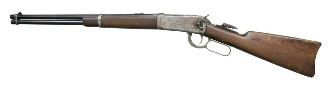 WINCHESTER 1894 LEVER ACTION SRC.: Cal. 25-35 WCF. S# 543117. Bbl. 20". Replacement pinned blade bead front sight, filler in rear dovetail w/ Marbles combination tang sight. Full length mag. Action has saddle ring on left side. Gumwood