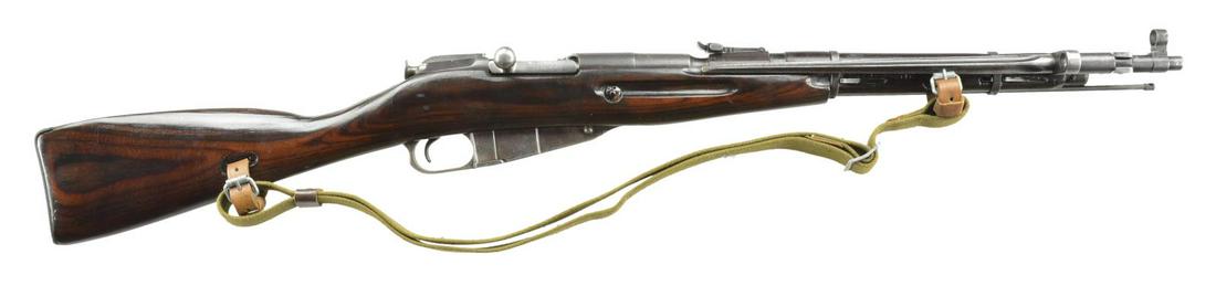 WWII USSR IZHEVSK MODEL 44 BOLT ACTION CARBINE.: Cal. 7.62x54R. S# W10703 (Importer S#). Matching Soviet S# on bolt & mag. floorplate. Bbl. 20.5" w/ protected post front sight & hinged folding 14" bayonet that latches over muzzle. 1,000m tangent rea