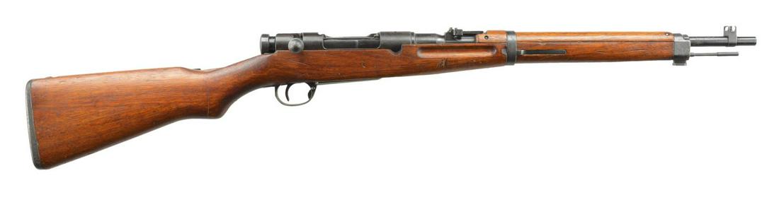 WWII SERIES 4 NAGOYA ARSENALTYPE 38 BOLT ACTION: CARBINE. Cal. 6.5 Jap . S# 80326. Bbl. 19" w/ protected blade front sight & 2,000m ladder rear sight. "Mum" on receiver ring is partially grounded off. Left side of receiver has Series 4, S# & Nagoya 