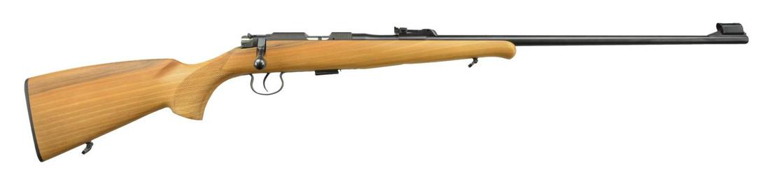 CZ BRNO 2-E BOLT ACTION RIFLE.: Cal. 22 LR. S# 462512 (1992). Bbl. 24.8" w/ hooded ramp blade front sight & 200m tangent rear sight. Receiver has AAL import mark & grooved top for tip off scope mts. Checkered pistol grip hardwood st