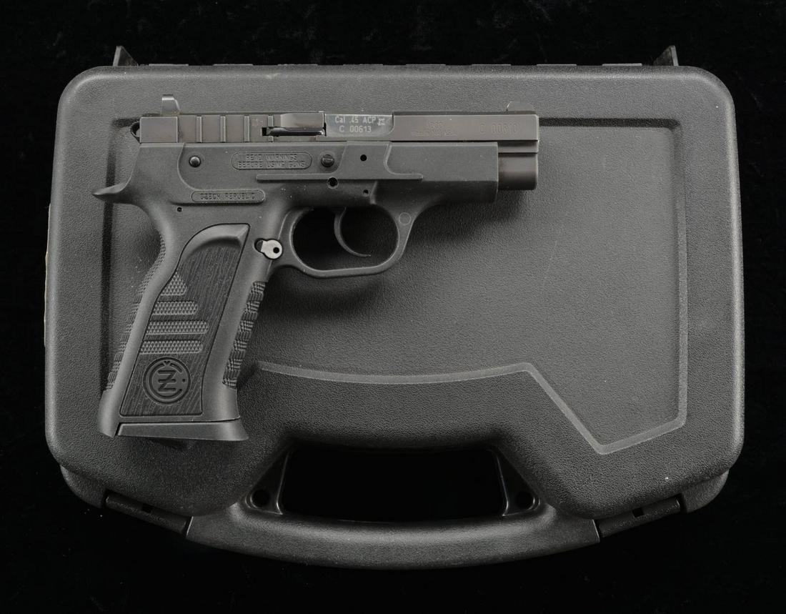 CZ TT45 PISTOL.: Cal. 45 ACP. S# C00613. Bbl. 4". A polymer framed traditional DA pistol w/ serrated & ported slide. High profile 3 dot sights. Left side controls. Knurled surface on grip sides, front & back strap. Ma