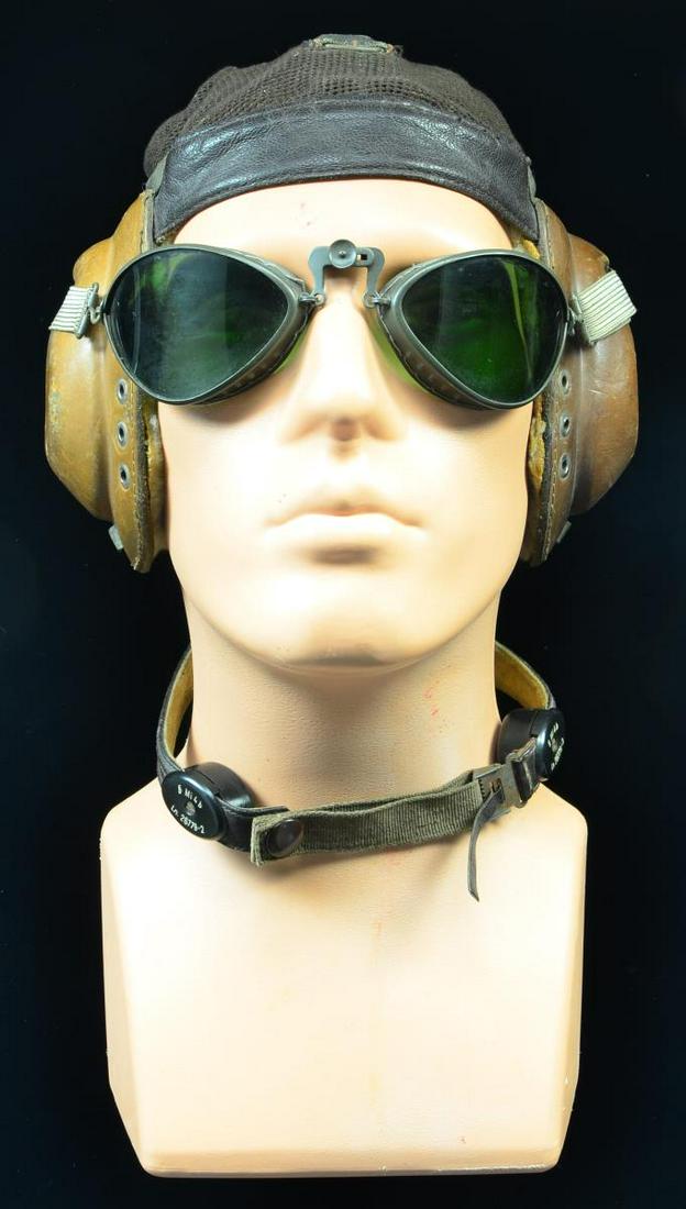 WWII GERMAN LUFTWAFFE SUMMER FLIGHT HELMET.: The LKpN101 flight helmet had 2 different designs. The earlier utilized a 2 point attachment for the oxygen mask where the later war version had a 3 point attachment. Both designs were primarily used 