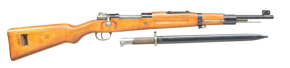 IRANIAN M49 MAUSER CARBINE.: Cal. 8mm Mauser. S #19346-29 (Translated from Farsi). Bbl. 18". All matching Farsi numbers. Receiver ring has Persian lion crest. Left receiver side rail has Farsi markings. Turned down bolt handle. T