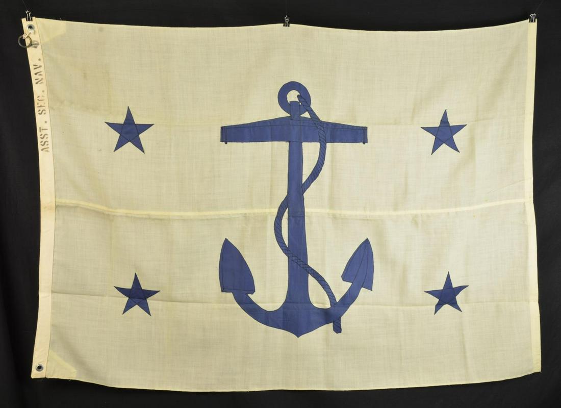 â€œASSISTANT SECRETARY OF NAVYâ€ FLAG.: 60” x 42” bunting with cotton stars and canvas hoist. Stenciled on hoist â€œASST. SEC. NAVY”. White bunting field displays large blue fouled anchor & 4 stars in each quadrant. Th