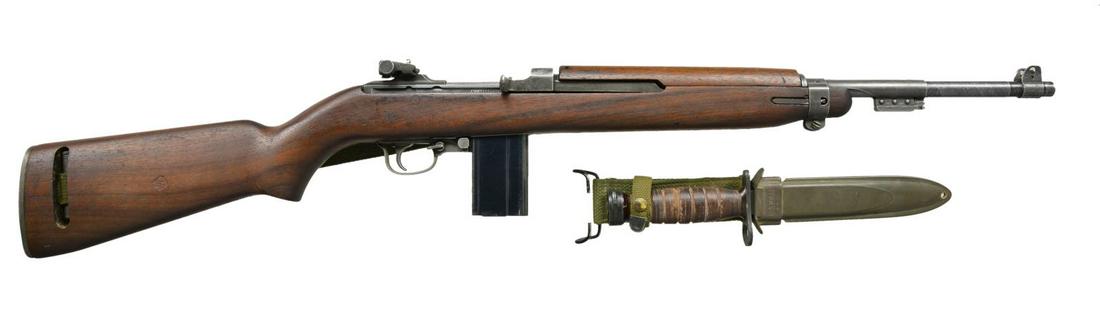 M1 CARBINE BY WINCHESTER WITH BAYONET.: Cal. 30 Carbine. S# 1201734. The 18" bbl. is unmarked. Parkerized action has correct markings on receiver ring & is fitted w/ windage/elevation adj. rear sight marked “I.R. CO.”. Walnut st