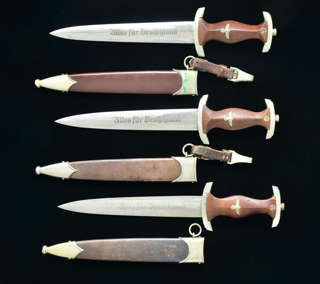 2 WWII GERMAN SA DAGGERS & 1 NSKK DAGGER.: 1) SA. Overall length: 14 11/16". Blade is etched, "Alles fur Deutschland" on the front and is marked, "KARL ROB. KALDENBACH KKR SOLINGEN-GR."on the reverse. Nickel pommel and crossguard marked on the