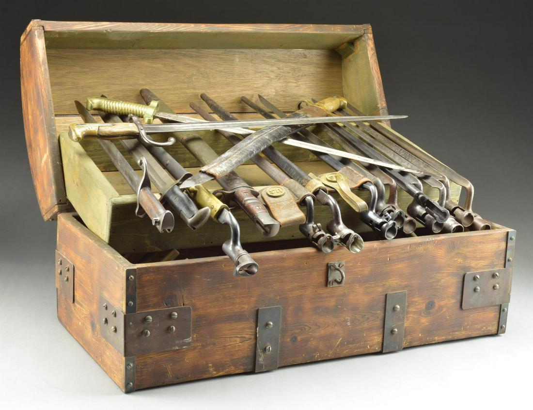 ECLECTIC & INTERESTING LOT OF VINTAGE & ANTIQUE: BAYONETS, SCABBARDS, AND WOODEN CHEST. Bayonets are both socket & knife type, some matched with scabbards & from a variety of countries of origin. 1) 3 U.S. Model 1816 bayonets: 15-5/8" triangular bla