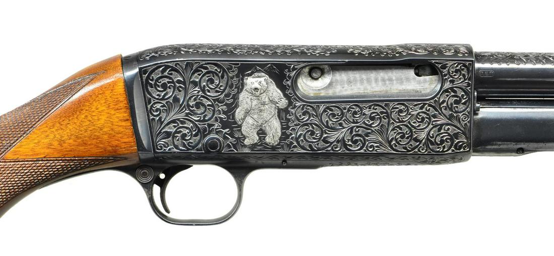 REMINGTON MODEL 14 CUSTOM ENGRAVED PUMP RIFLE.: Cal. 30 Rem. S# C80410. Bbl. 22" round with ramp mounted bead front sight with wheel adjustable V notch sporting rear sight. Spiral tubular magazine. Action and barrel have generous coverage of deep r
