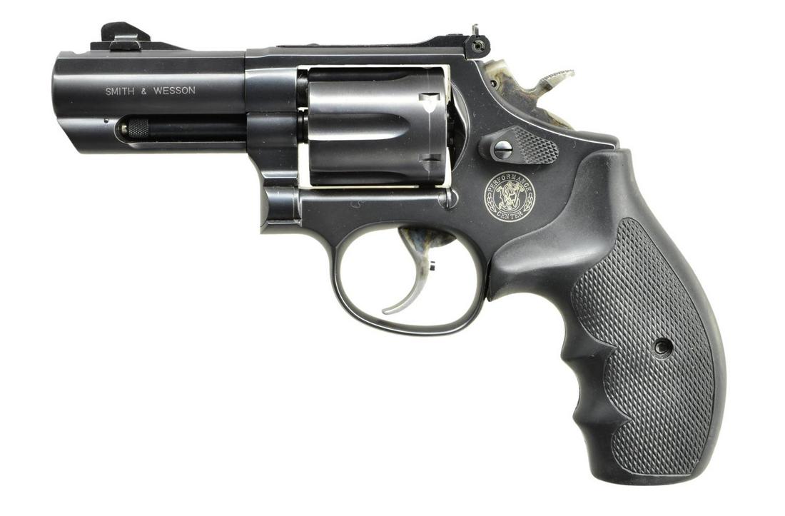 INTERESTING & UNIQUE SMITH & WESSON PERFORMANCE: CENTER 19-7 K COMP DA REVOLVER. Cal. 357 Mag. S# SDA0000. Bbl. 3" ported w/ front ramp Tritium night sight & micrometer rear sight. Blue finished, rnd. butt, K target frame w/ 6 shot fluted swing out