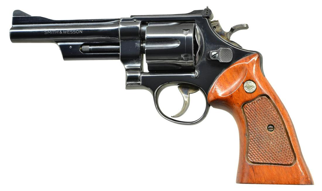 SMITH & WESSON 27-2 DA REVOLVER.: Cal. 357 Mag. S# N607659. Bbl. 5" with rib and shrouded ejector. Serrated ramp front sight with square notch adjustable rear sight. 6 Shot fluted cylinder. N frame 3 screw action with pinned barrel. B