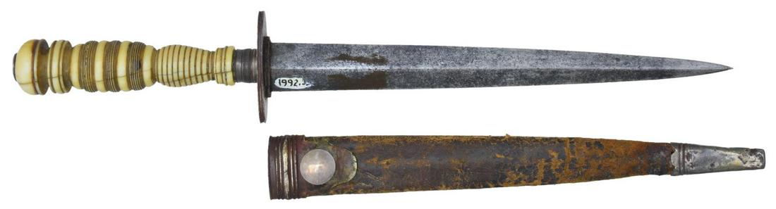 FEDERAL PERIOD AMERICAN OR BRITISH NAVAL DIRK.: Overall length: 9 3/16". Blade length: 6 3/4". Plain blade has a raised medial ridge. Silvered, elliptical crossguard, ferrule and small pommel cap. Very intricately turned certifiably antique grip. S