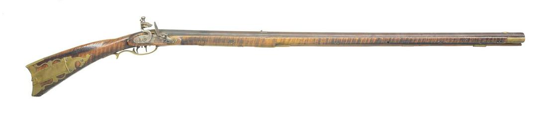 FLINTLOCK SAMUEL BAUM NEW BERLIN PENNSYLVANIA: RIFLE. Cal. 52 rifled bore. NSN. Bbl. 39" full oct. Overall length 54". Bbl. signed â€œS.B.”. Samuel Baum flintlock curly maple rifle w/ 4-piece brass patchbox w/ 4 piercings. The rifle has