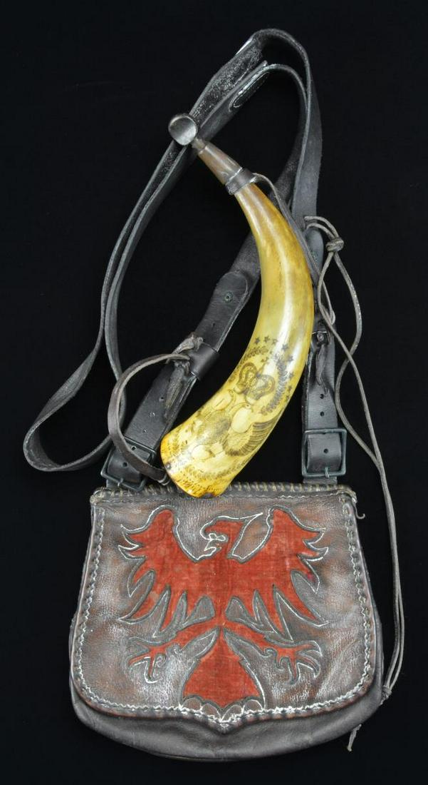EAGLE DECORATED POSSIBLES BAG AND SMALL POWDER: HORN BY GARY BIRCH. Brown leather bag with shoulder strap has cover cut out in spread eagle shape and restitched with red cloth underneath. Nicely made small horn, 10" overall is nicely scrimmed with 