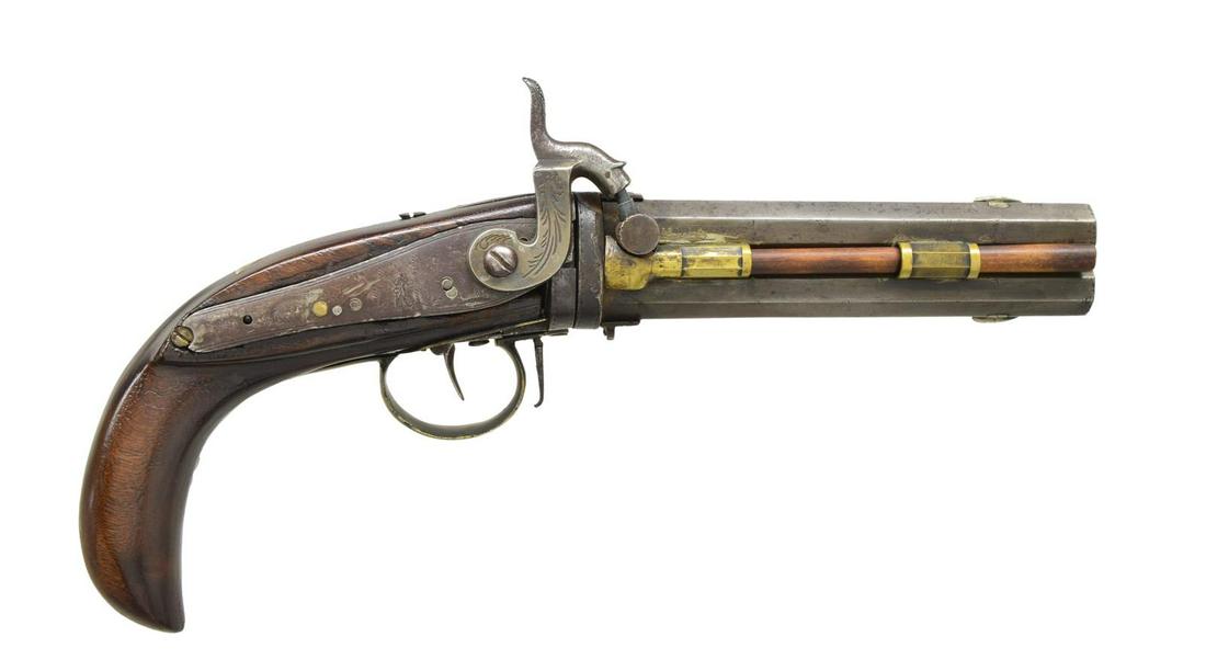 O/U PERCUSSION SWIVEL BREECH PISTOL.: 52 Cal. 6 1/2" octagon bbls. Lg. "G. Goulcher" back action percussion lock. The side plate is nicely engraved brass. There is a lg. silver inlay behind the bbl. tang. CONDITION: the lock & swivel mech