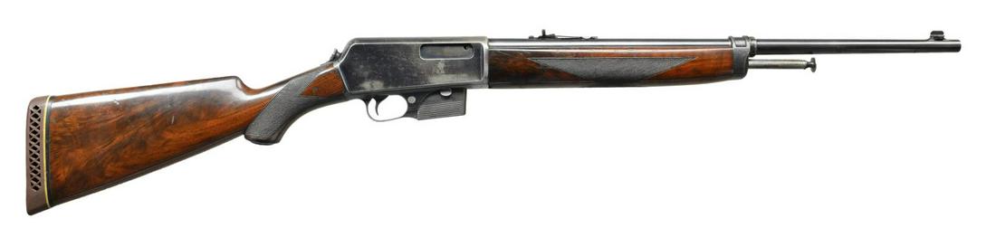 WINCHESTER 1907 DELUXE SELF LOADING RIFLE.: Cal. 351 SL. S# 20906. Bbl. 20". Replacement blade front sight with replacement Marbles flat top sporting rear sight. Left side of receiver has 3 open holes from receiver sight attachment. Forearms &