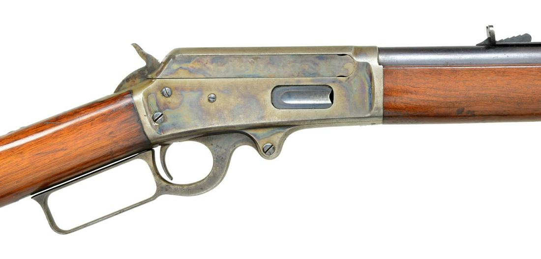 MARLIN 1893 EXTRA LENGTH LEVER ACTION RIFLE.: Cal. 38-55. S# 95076. Rare 30" rnd. bbl. Extra length magazine extends to 2 1/4" from muzzle. German silver blade Rocky Mountain front sight with elevator adj. sporting rear sight. Blue finish w/ case
