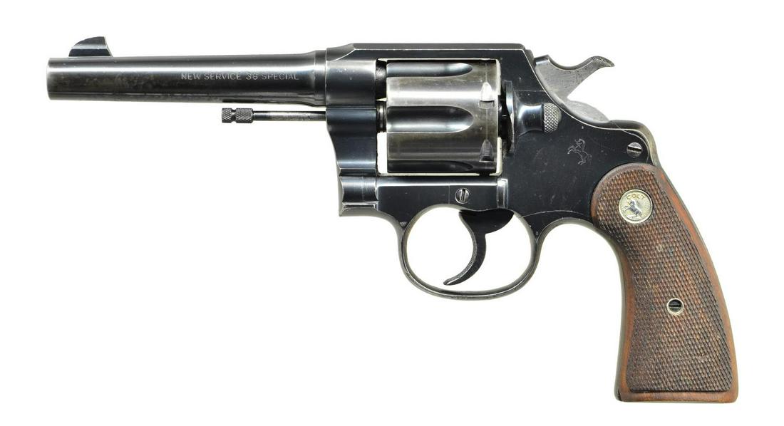 COLT TENNESSEE VALLEY AUTHORITY MARKED NEW SERVICE: DA REVOLVER. Cal. 38 Spl. S# 337602. Bbl. 5" with blade sight. 6 Shot fluted cylinder. Blue finish with polished hammer sides. 2 Piece checkered walnut grips with silver Rampant Colt medallions. Butt 