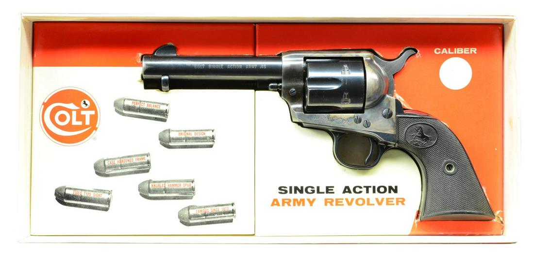 COLT SECOND GEN STAGECOACH BOX SAA REVOLVER.: Cal. 45 Colt. S# 56121SA. Bbl. 4 3/4" with blade sight. 6 Shot fluted cylinder. Blue and case colored finish. Hammer sides are polished. 2 Piece black checkered grips with Rampant Colt motif. Mfg. 197