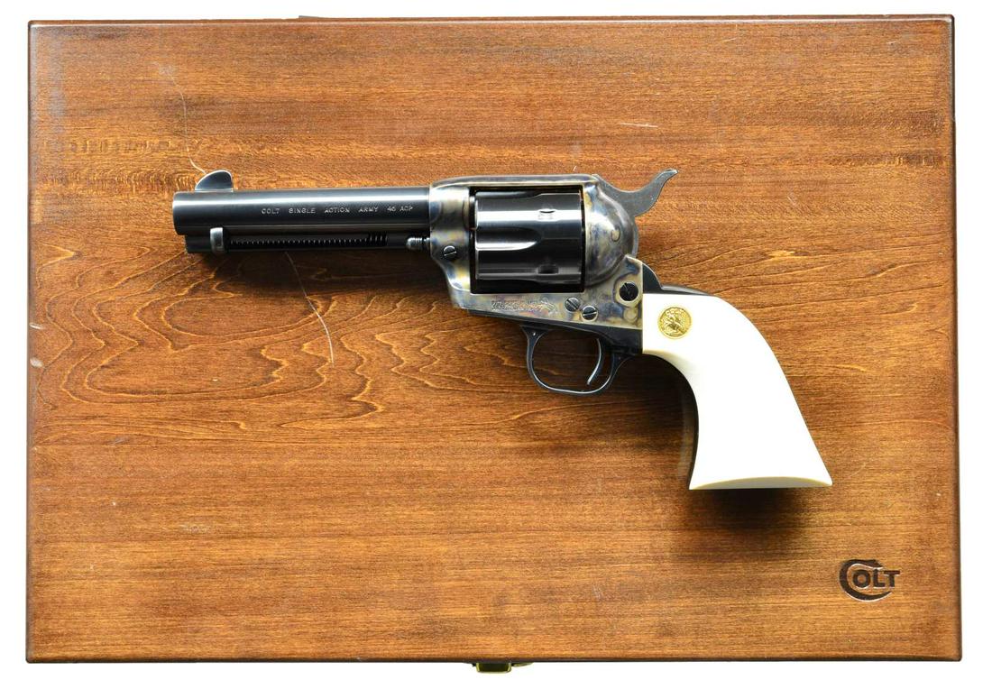 COLT CUSTOM SHOP THIRD GEN SAA REVOLVER.: Cal. 45 ACP / 45 Colt. S# SA65384. Bbl. 4 3/4" with blade sight, caliber marking is "45 ACP". 6 Shot fluted cylinder. Blue and case colored finish with polished hammer sides. 2 Piece grips with gold R