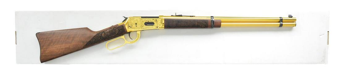 WINCHESTER 1894 AMERICAN LEGACY MONTANA: COMMEMORATIVE LEVER ACTION RIFLE. Cal. 30-30. S# ALF1500490. Bbl. 20". Full brilliant gold anodized finish. Action has special American theme engraving featuring bald eagle on left side between banner