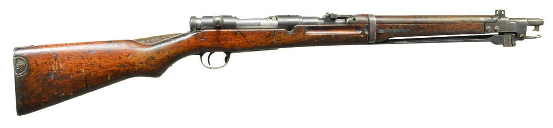 JAPANESE TYPE 44 ARISAKA BOLT ACTION CARBINE.: Cal. 6.5 Jap. S# 12070. Bbl. 19". Early Tokyo arsenal mfg. example w/ first type bayonet housing. Ground mum. Rear sight & bayonet housing have matching assembly numbers but other parts are mismatched