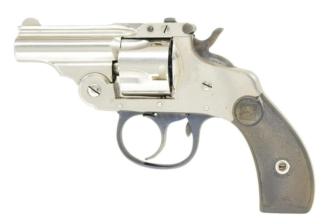 HARRINGTON & RICHARDSON MODEL 2 TOP BREAK: REVOLVER. Cal. 32 S&W Short. S# A27465. Matching numbered 2" bbl w/ rib marked "H&R ARMS CO./ WORCESTER. MASS." Matching numbered 5 shot fluted cyl. & extractor. Checkered brown grips w/ target logo.