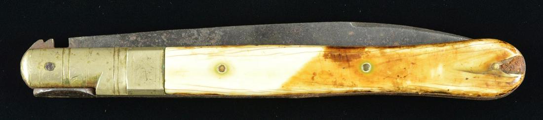 VERY LARGE CIVIL WAR ERA FOLDING BOWIE KNIFE.: 16.5" Overall opened, 8.5" spear point blade, 9" closed, ivory slab grips, no discernible maker mark, heavy German silver bolster with spring lock. CONDITION: good overall, ivory heavily patinaed & we