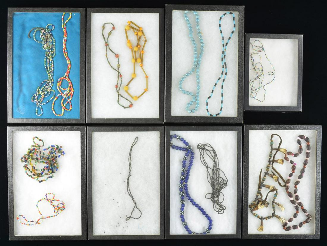 14 STRANDS OF 19TH & EARLY 20TH CENTURY NATIVE: AMERICAN TRADE BEADS. These beads represent many different styles and colors. The vast majority are round or tubular. Some are clear, others are opaque, all are strung on various lengths of string, si