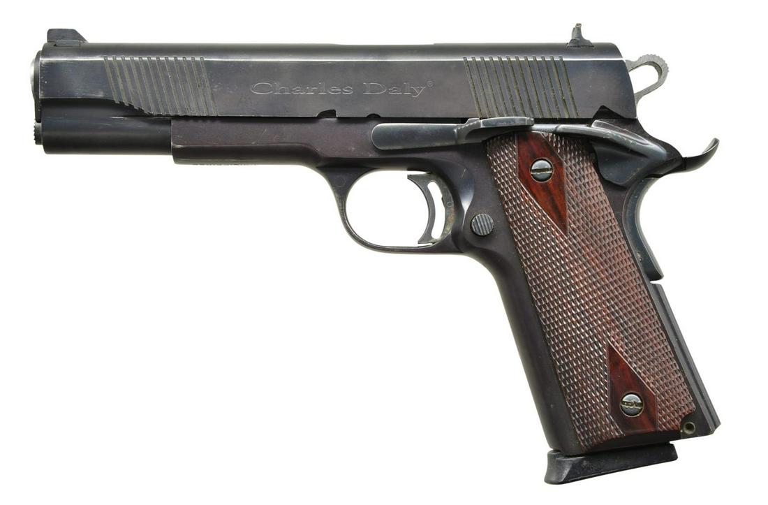 CHARLES DALY 1911A1 SEMI AUTO PISTOL.: Cal. 45 ACP. S# CD003946. Bbl. 5". Mfg. by Armscore & imported by KBI. Square notch rear sight & ramped front sight. Skeletonized trigger & hammer. Brightly finished bbl. Ambidextrous safety & beavert