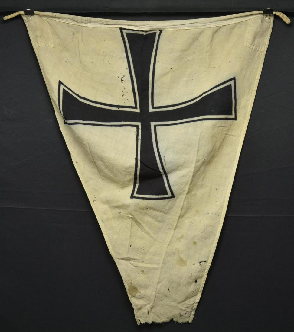 3 GERMAN FLAGS AND 1 PATRIOTIC TEXTILE.: 1)NAVAL PENNANT. A WWII German Naval Pennant featuring a black Maltese cross on a white field. Pennant currently approx. 33" high x 44" long, however, the pennant appears to be missing approx. 12" fro