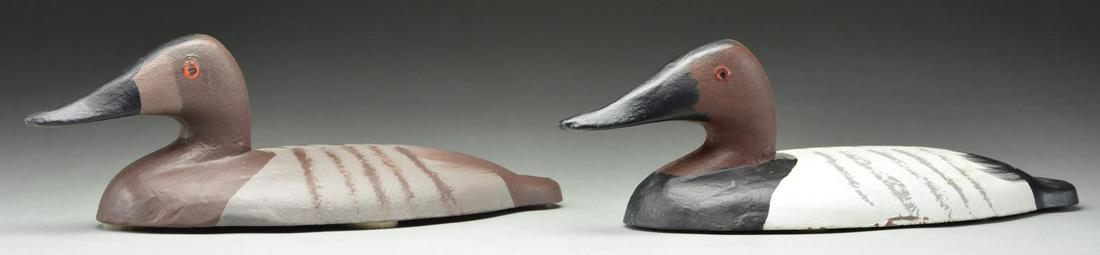 2 "SA" 1960'S CAST IRON CANVASBACK DECOYS.: 1) 1967 DATED . 14" Length. 5" Height. Brown painted crown. Black painted breast, bill & tail. White painted mantle & gray scapulars. Red painted eye rings. Bottom stamped "67 / SA / X-X I". Base has 