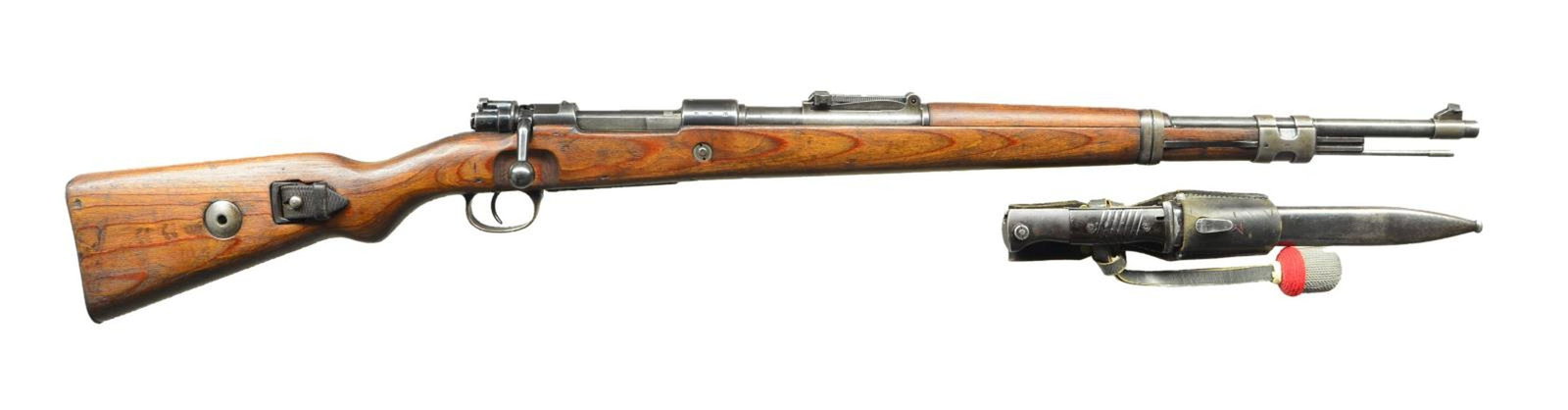 GERMAN WWII MAUSER MANUFACTURED MODEL 98K BOLT: ACTION MILITARY RIFLE. Cal. 8mm Mauser. S# 2065ff. All visible numbers match. Bbl. 23 5/8". Tangent rear sight graduated to 2,000 meters. Inverted V front sight. Receiver ring marked on top "42" & "19