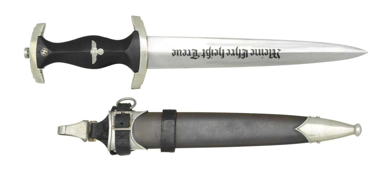 WWII GERMAN M1933 SS DAGGER.: Overall length 14 11/16”. Blade is etched on one side “Meine Ehre Heisst Treue” and is marked near the hilt on the other side “GOTTLIEB HAMMESFAHR (logo) SOLINGEN.FOCHE”.