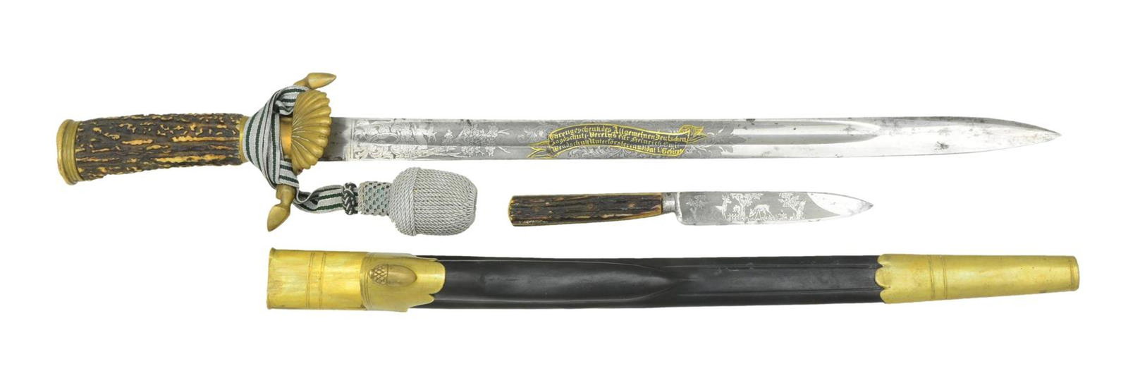 IMPERIAL GERMAN FORESTRY/HUNTING CUTLASS.: This fine Imperial German presentation cutlass measures 22 1/2" overall. The blade has a single wide fuller and is etched over 8 3/4" of its length. The etching includes foliate & hunting motifs, incl