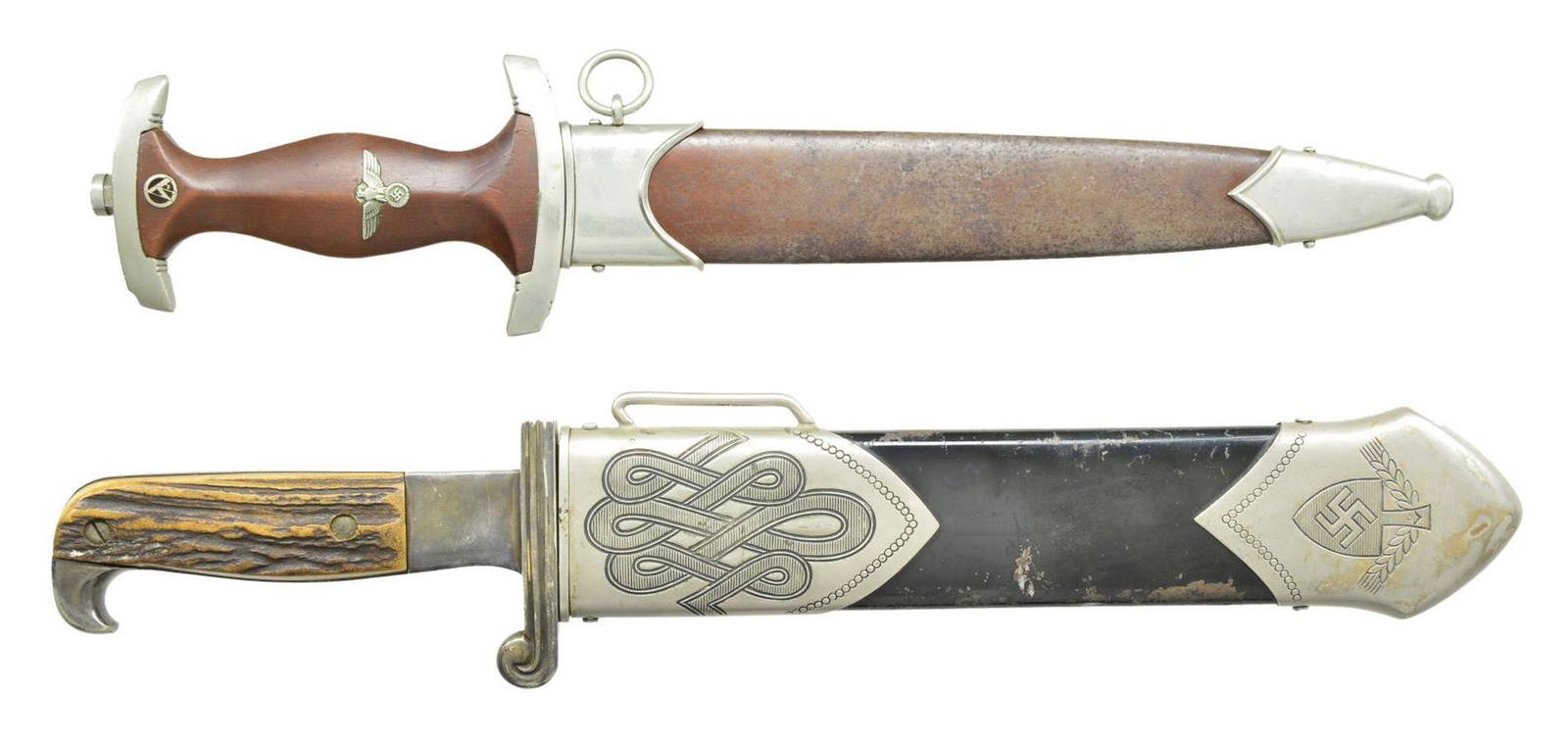 2 WWII GERMAN DAGGERS.: 1) SA. Overall length 14 5/8". Blade is etched “Alles fur Deutschland” on one side & marked “WILH. WELTERSBACH SOLINGEN (logo)” on the other. Nickel silver cross guard stamped