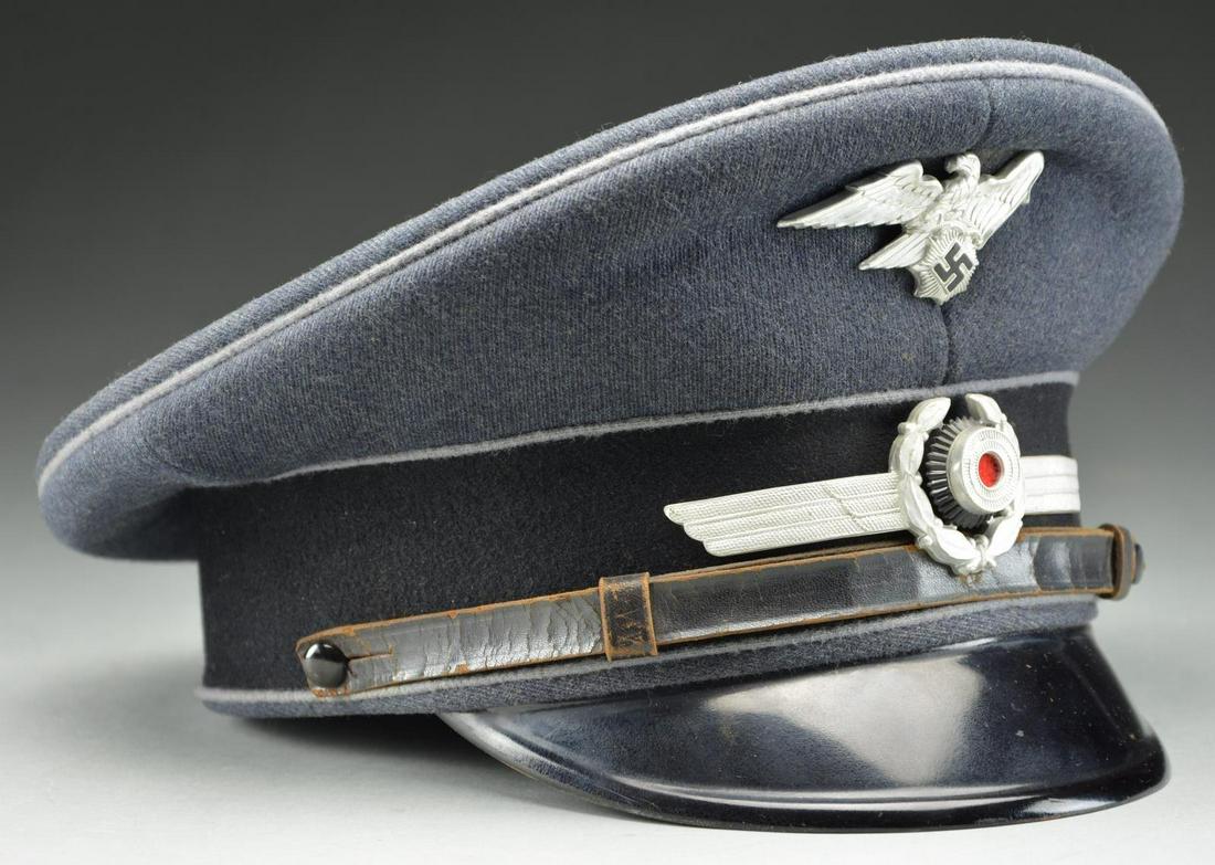 WWII GERMAN LUFTSCHUTZ VISOR CAP.: This visor cap is a high-quality non-leader grade cap with a gray crown and black band all piped in gray. The black leather chinstrap is terminated by plain black buttons and the visor has a black fin
