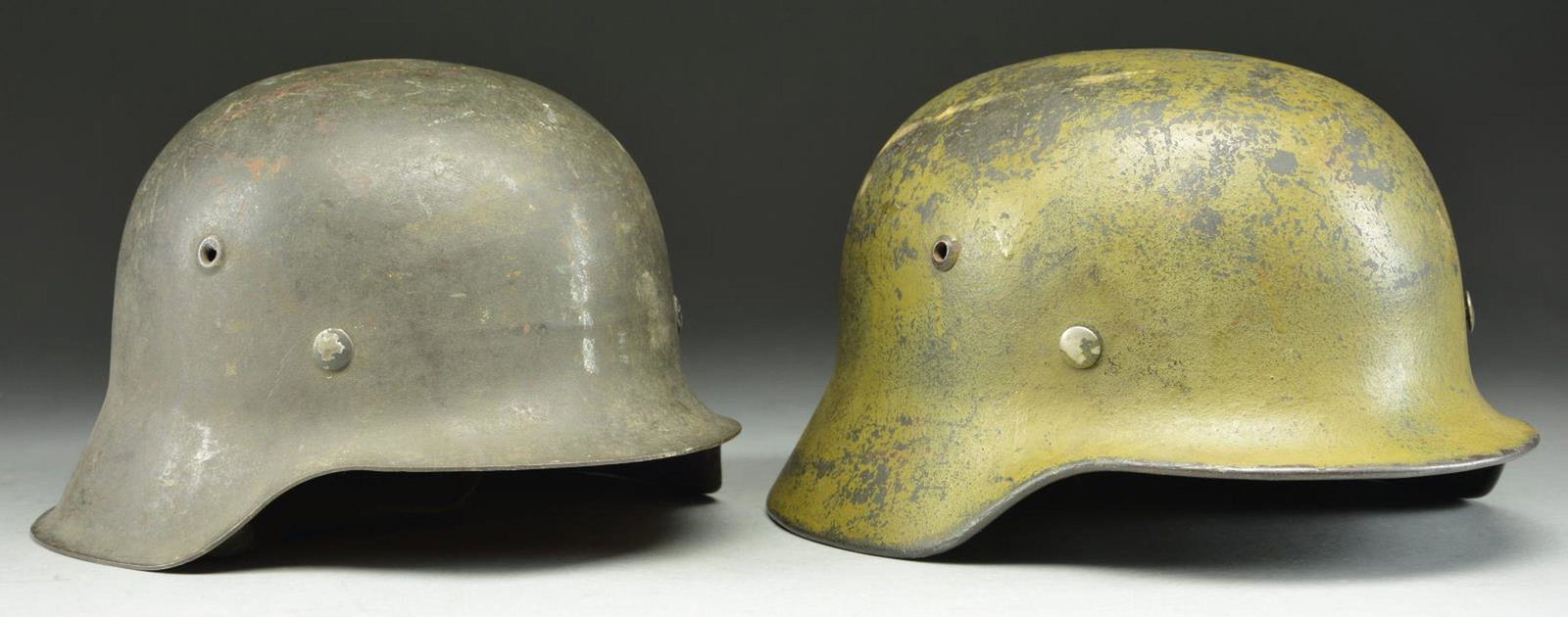 2 WWII GERMAN HELMETS BROUGHT BACK BY A DENTAL: OFFICER NAMED WATSON. These two helmets were sent back during WWII to the officer’s son, W. James Watson, who was 12 years old at the time. The helmets have been with Dr. Watson since 1942 until