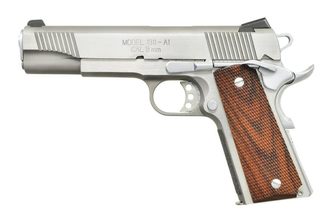 9MM STAINLESS STEEL SPRINGFIELD ARMORY MODEL: 1911 A1 PISTOL. Cal. 9mm. S# N421459. Bbl. 5". Stainless steel finish. Front & rear serrated slide. Novak sights; blade front & drift adjustable rear. Skeletonized hammer w/ serrated spur. Extended th