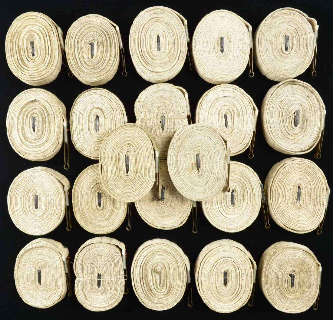 50 BROWNING MODEL 1919 CLOTH BELTS.: Lot of 50 cloth belts for feeding Browning Model 1919 MG. 8 cloth 100 rd. belts, white w/ black stitching, each end terminated w/ brass grommet. Most appear as new or very lightly used at most. 37 of 