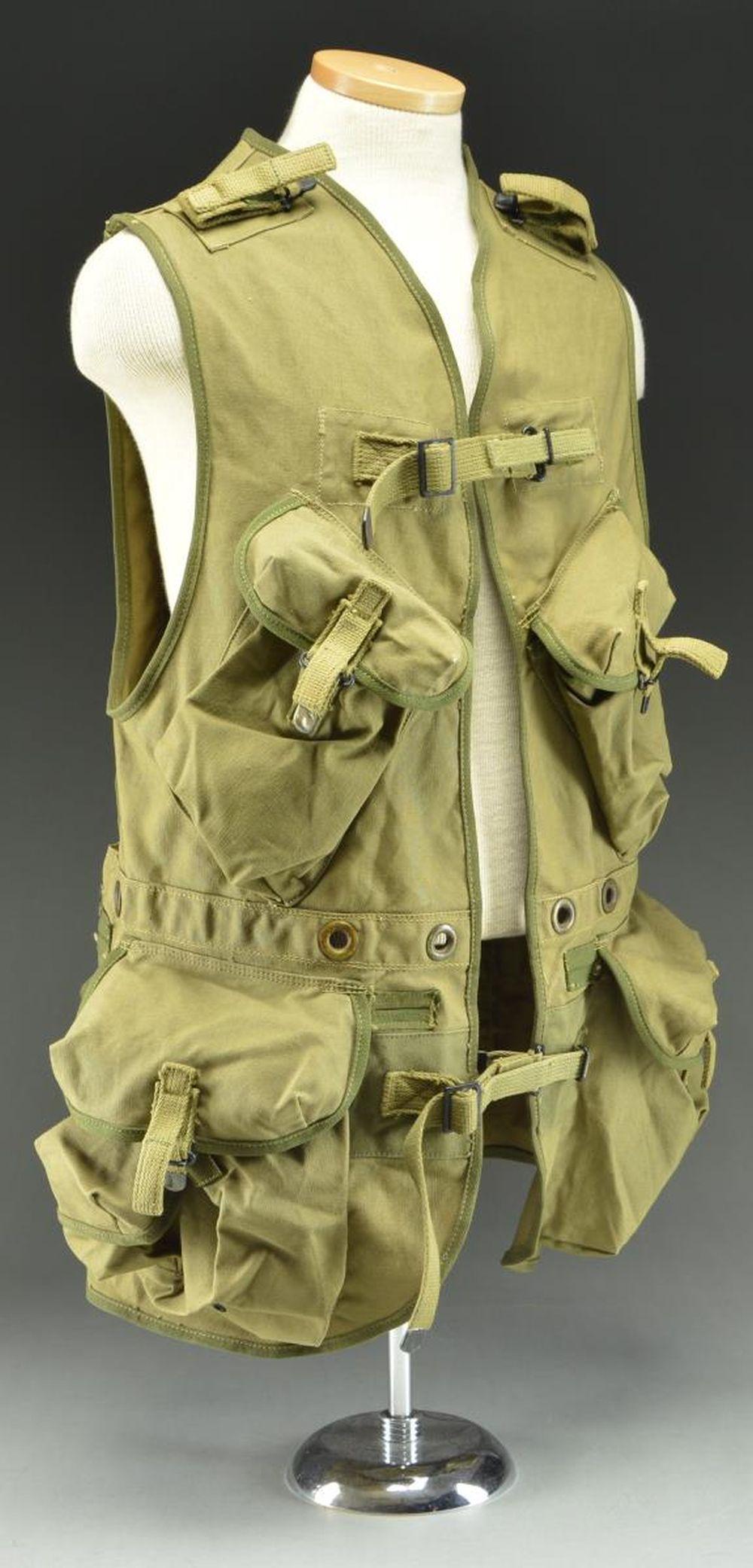 WWII US D-DAY ASSAULT VEST BY HARIAN.: A fine example of a scarce D-Day assault vest produced in 1944 primarily for the first wave of US assault troops during the D-Day landings. The vest was produced by Harian in England and is size mediu