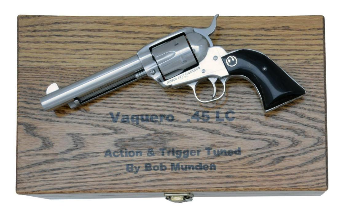 RUGER (BOB MUNDEN TUNED) STAINLESS VAQUERO: REVOLVER. Cal. 45 Colt. S# 511-38470. Bbl. 5 1/2” w/ blade sight & warning marks discreetly on bottom. Mfg. 2012 in stainless as Model 05104. Enhanced by renowned single action exhibition shoote