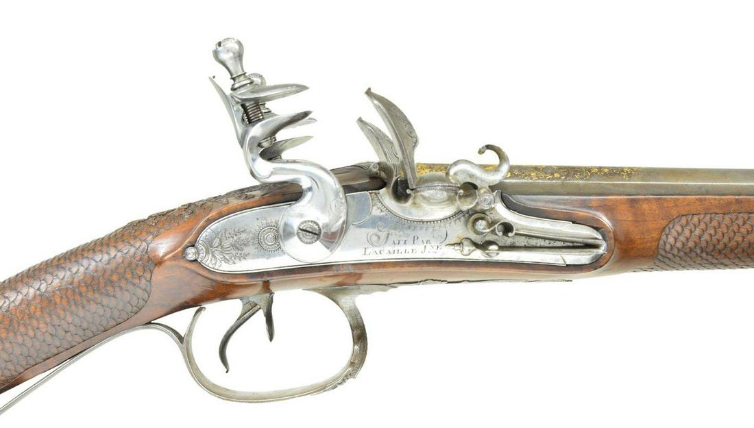 SUPERB QUALITY CLASSIC ERA FRENCH DOUBLE: FLINTLOCK SHOTGUN BY JACQUES LACAILLE OF BLOIS WITH CUSTOM CASE AND FINE EARLY ACCESSORIES BY BOCHEIeur. Cal. 24 Ga. .586 bore diameter. S# NSN. Jacques Lacaille was working in Blois central France (a