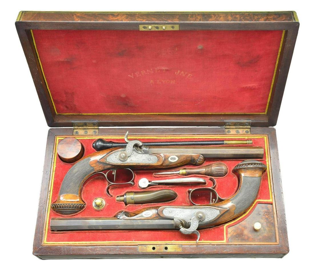 CASED PAIR OF BELGIAN PERCUSSION TARGET PISTOLS: WITH ACCESSORIES. Cal. 50 (pr). S# 10898 (on bottoms of barrels). These good quality pistols are not maker marked. They have 9 1/2" octagon barrels with well filed patent breeches. Bottoms are stamped
