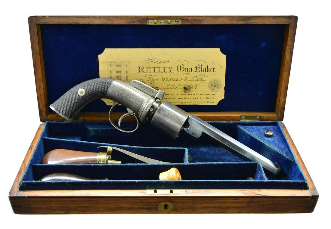 BRITISH PEPPERBOX TYPE ACTION REVOLVING CYLINDER: PERCUSSION REVOLVER BY E. M. REILLY WITH CASE AND ACCESSORIES. Cal. 48. S# NSN. This high condition early British revolver has blued 5 1/2" octagon barrel which attaches to pepperbox type frame with t