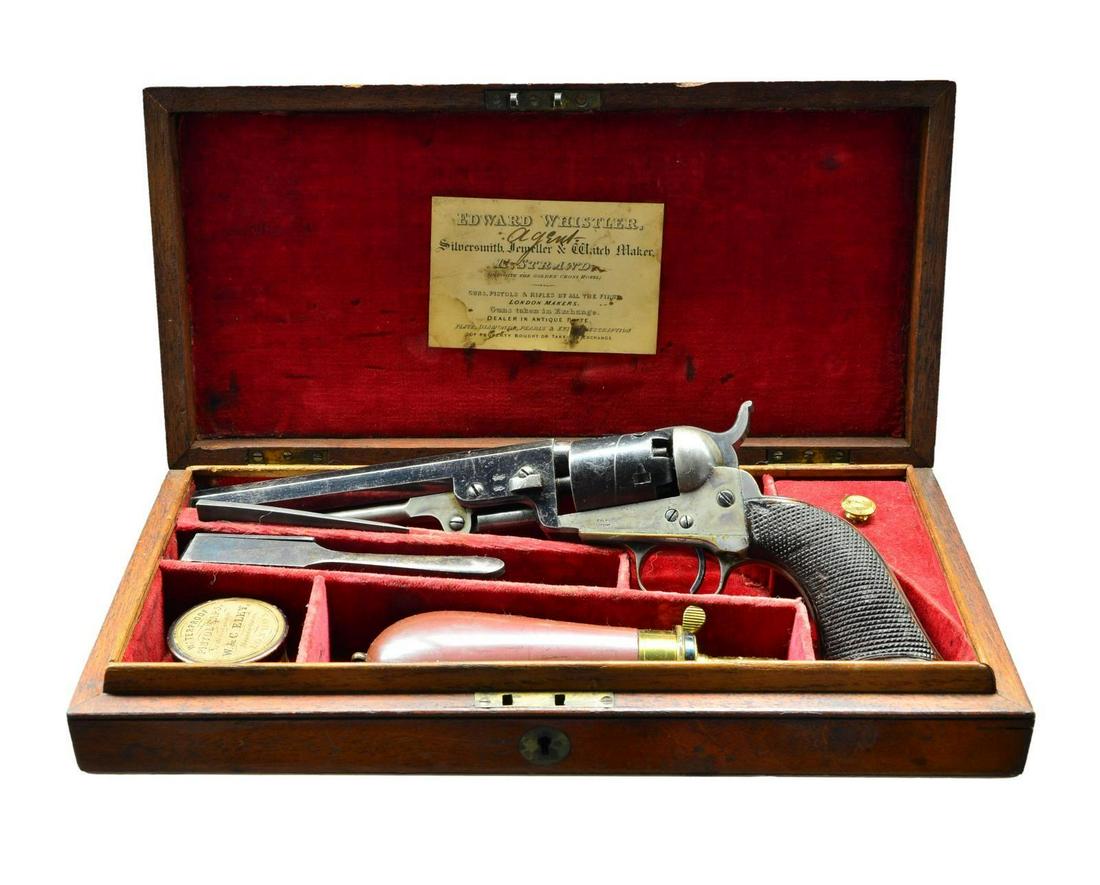 FINE CASED LONDON COLT POCKET MODEL REVOLVER.: Cal. 31. S# 47902. Bbl. 6” octagon w/ London address. Round six shot cyl. w/ stagecoach scene roll engraving. Left side of bbl. has 2 British proofs. Blue & case colored finish w/ silver finishe