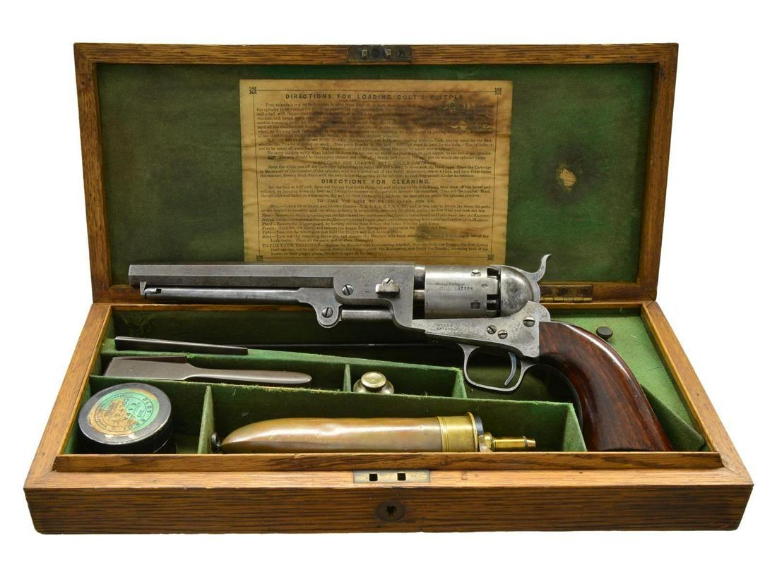 UNUSUAL LONDON CASED COLT 1851 NAVY REVOLVER.: Cal. 36. S# 17366. Bbl. 7 1/2” octagon w/ London address. Round six shot cyl. w/ naval engagement scene engraving. Cyl. & left side of bbl. have British proofs. Backstrap is engraved w/ initials